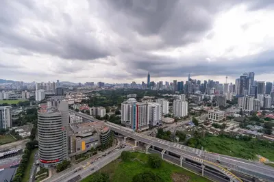 an aerial view of a city with a highway at Neu Suites By Cozy Unit L20RA near KLCC & Jelatek LRT in Kuala Lumpur