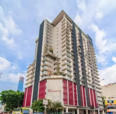 a large apartment building with a red and white facade at D'Majestic Place in Kuala Lumpur