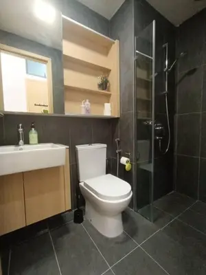 a bathroom with a toilet and a shower and a sink at COL 27B KLCC View & Infinity Pool View in Kuala Lumpur