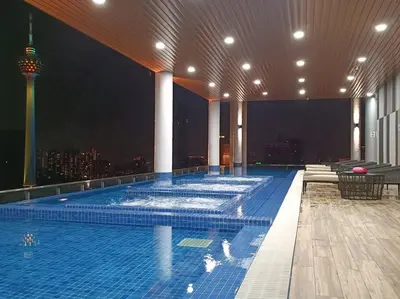 a large swimming pool on the top of a building at COL 27B KLCC View & Infinity Pool View in Kuala Lumpur