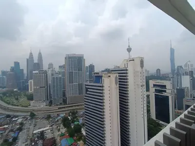 a view of a city skyline with tall buildings at COL 27B KLCC View & Infinity Pool View in Kuala Lumpur