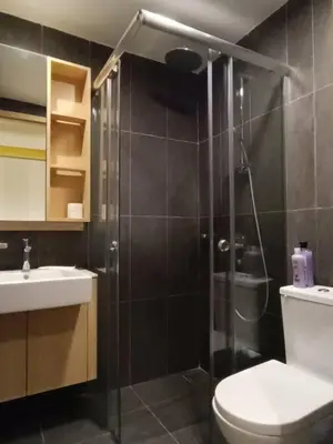 a bathroom with a shower and a toilet and a sink at COL 137B Modern Balcony KLCC View & Infinity Pool in Kuala Lumpur