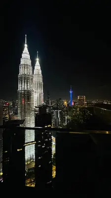 a view of the london skyline at night at Star Serviced Suite KLCC in Kuala Lumpur