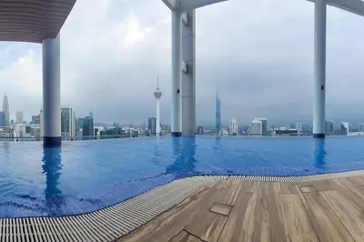 a large swimming pool with a view of the city at COL 30A Super Balcony KLCC KL Tower View in Kuala Lumpur