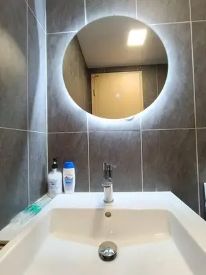 a bathroom with a sink with a mirror above it at COL 23aA Cozy KLCC View & Infinity Pool Studio in Kuala Lumpur