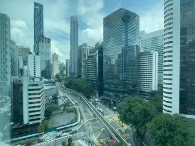 a busy city street with traffic in a city at Vortex Suites klcc By Sayang in Kuala Lumpur