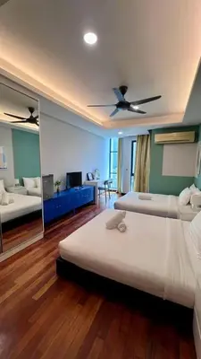 a bedroom with two beds and a ceiling fan at KL Homestay at Casa Residency- Walk to Lalaport & LRT in Kuala Lumpur