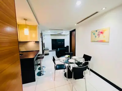 a living room with a table and chairs at KL Homestay at Casa Residency- Walk to Lalaport & LRT in Kuala Lumpur