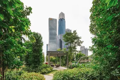 a park in the city with tall buildings at Japandi 1BR Agile Bukit Bintang by RumaBnB in Kuala Lumpur
