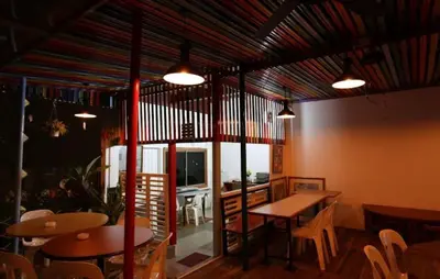 a restaurant with tables and chairs in a room at Hotel La ISRA at Bukit Bintang in Kuala Lumpur