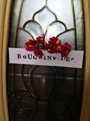 a sign on a door with flowers on it at Kuala Lumpur Homestay Bandar Sri Permaisuri in Kuala Lumpur
