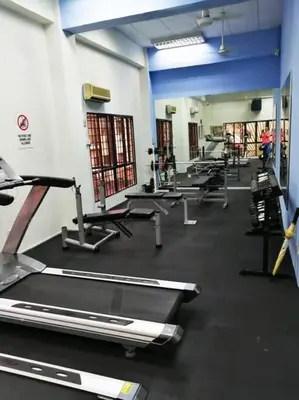 a gym with a row of treadmills and machines at Kuala Lumpur Homestay Bandar Sri Permaisuri in Kuala Lumpur