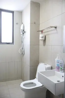 a bathroom with a white toilet and a sink at Cozy kenwingston Platz KL 2-5 pax 2BR&2BR genting view parkin netflix 3802 in Kuala Lumpur