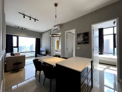 a kitchen and living room with a table and chairs at KL Suites Axon Residence - Wi-Fi 500Mbph in Kuala Lumpur