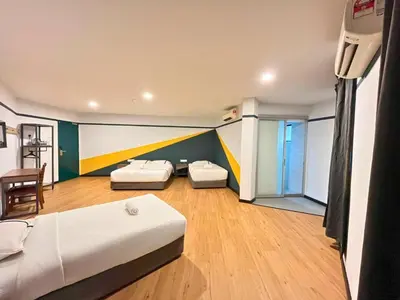 a bedroom with two beds in a room at Sky Hotel Cheras Maluri in Kuala Lumpur