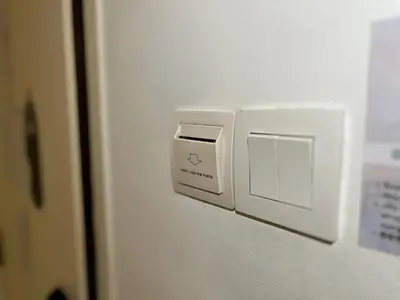 a white switch on a wall in a room at Sky Hotel Cheras Maluri in Kuala Lumpur