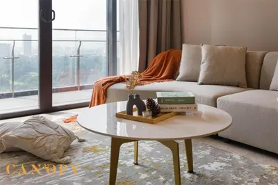 a living room with a couch and a table at The Manor Signature Residence, Kuala Lumpur in Kuala Lumpur