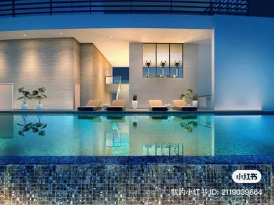 a large swimming pool in a building with chairs at Ooak suites Mont Kiara 163 \uc624\ud06c\uc2a4\ud14c\uc774 in Kuala Lumpur