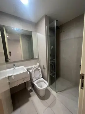 a bathroom with a toilet and a sink and a shower at The Ooak Kiara 163 in Kuala Lumpur