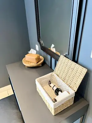 a dressing table with a basket and a mirror at Cozy Axon Residence Bukit Bintang by Konoha Suites 1-6pax in Kuala Lumpur