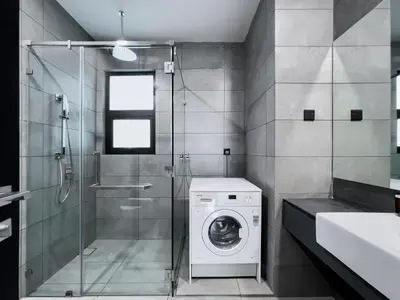 a bathroom with a washing machine and a shower at Opus Residences by Wakely Kuala Lumpur in Kuala Lumpur