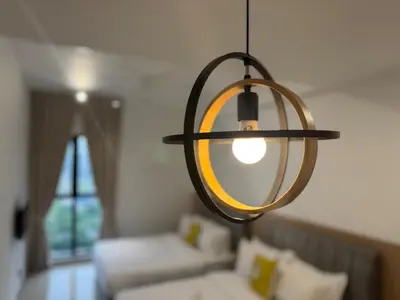 a light fixture hanging from a room with a couch at Trion Kuala Lumpur Superior room nearby mrt in Kuala Lumpur