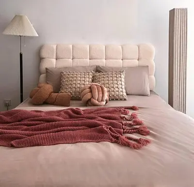 a bed with a white headboard and a red blanket at Tranquil Den EkoCheras KL in Kuala Lumpur