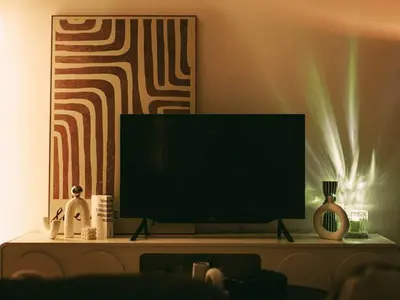 a flat screen tv sitting on top of a table at Tranquil Den EkoCheras KL in Kuala Lumpur