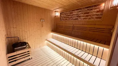 an inside view of a sauna with benches and lights at Cozy Axon Residence Bukit Bintang by Konoha Suites 1-3pax in Kuala Lumpur