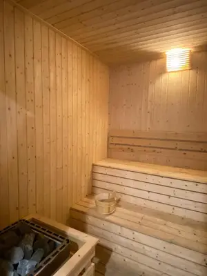 a wooden sauna with a light on top of it at Upper Hotel Suites KL Sentral in Kuala Lumpur