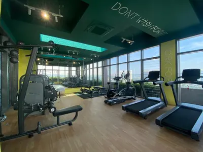 a gym with treadmills and exercise equipment in a building at Upper Hotel Suites KL Sentral in Kuala Lumpur