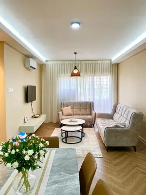 a living room with a couch and a table at Best Spot in City in Kuala Lumpur