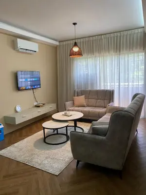 a living room with a couch and a table at Best Spot in City in Kuala Lumpur