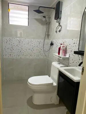 a bathroom with a toilet and a sink at Best Spot in City in Kuala Lumpur