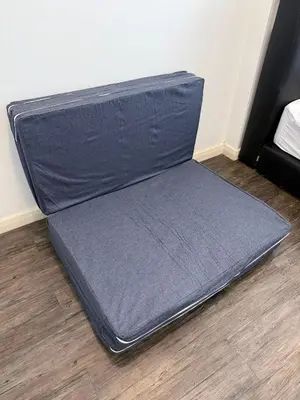 a suitcase sitting on the floor in a room at Cozy Downtown 2BR at M Suites, Embassy Row in Kuala Lumpur