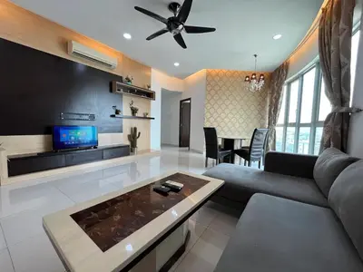 a living room with a couch and a tv at Nice stay by regalia in Kuala Lumpur