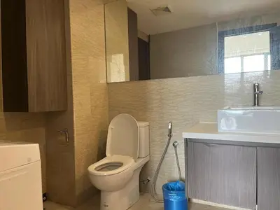 a bathroom with a toilet and a sink at Nice stay by regalia in Kuala Lumpur