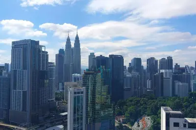 a view of a large city with tall buildings at 2-Bedroom Apartment in Kuala Lumpur City Center in Kuala Lumpur