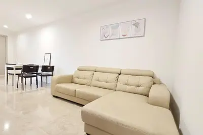 a living room with a couch and a table at Bukit Bintang Fairlane 1412 for 1-5pax 1BR TRX Pavilion KL in Kuala Lumpur