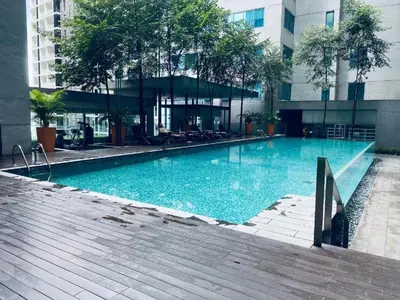 a large swimming pool in front of a building at Prime Summer Suites KLCC in Kuala Lumpur