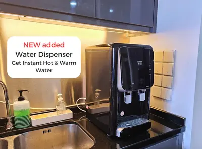 a new added water dispenser sitting on a kitchen counter at The Mews Kuala Lumpur Homestay with Bathtub 700m to KLCC by Cloud Host in Kuala Lumpur