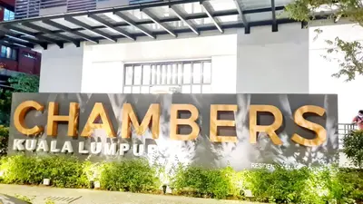 a sign for the champs kuala lumpur headquarters at Chambers Suites KLCC By Glory Homes in Kuala Lumpur