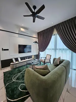 a living room with a couch and a ceiling fan at Alfa Bangsar by City Keys in Kuala Lumpur
