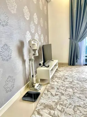 a room with a microscope and a monitor on a wall at Trion Kuala Lumpur KLCC view L65 2br 2bth in Kuala Lumpur