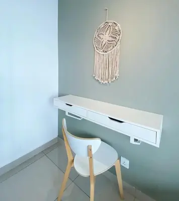 a white desk and a white chair in a room at Arte plus by dream stay in Kuala Lumpur