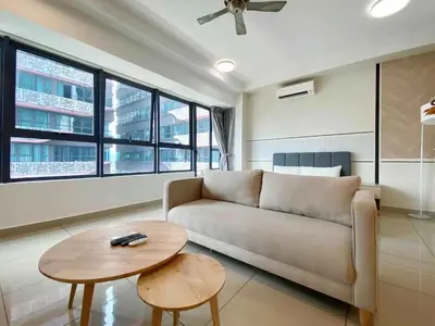 a living room with a couch and a table at Arte plus by dream stay in Kuala Lumpur