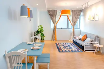 a living room with a blue table and a couch at My home at Kuala Lumpur in Kuala Lumpur