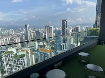 a balcony with a view of a city at Cozy Comfy & Affordable Place at KLCC in Kuala Lumpur