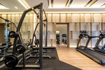 a gym with several treadmills and cardio machines at Maxhome-Agile Bukit Bintang TRX in Kuala Lumpur