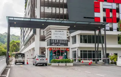 a parking lot in front of a building at Inspirasi at Mont Kiara by Airhost in Kuala Lumpur